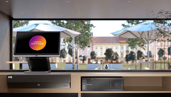 Computer monitor sits on a countertop at a coffee shop with the DN Series BEETLE retail POS systems logo on the screen